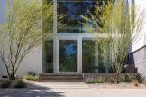 Front entry framed by Palo Verde trees
