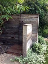 Copper outdoor shower with recycled barn siding